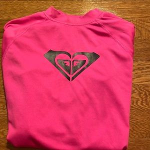 this is a hot pink roxy rash guard